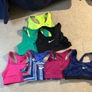 4 Nike Sports Bras. No padding. Size small. Get three free!